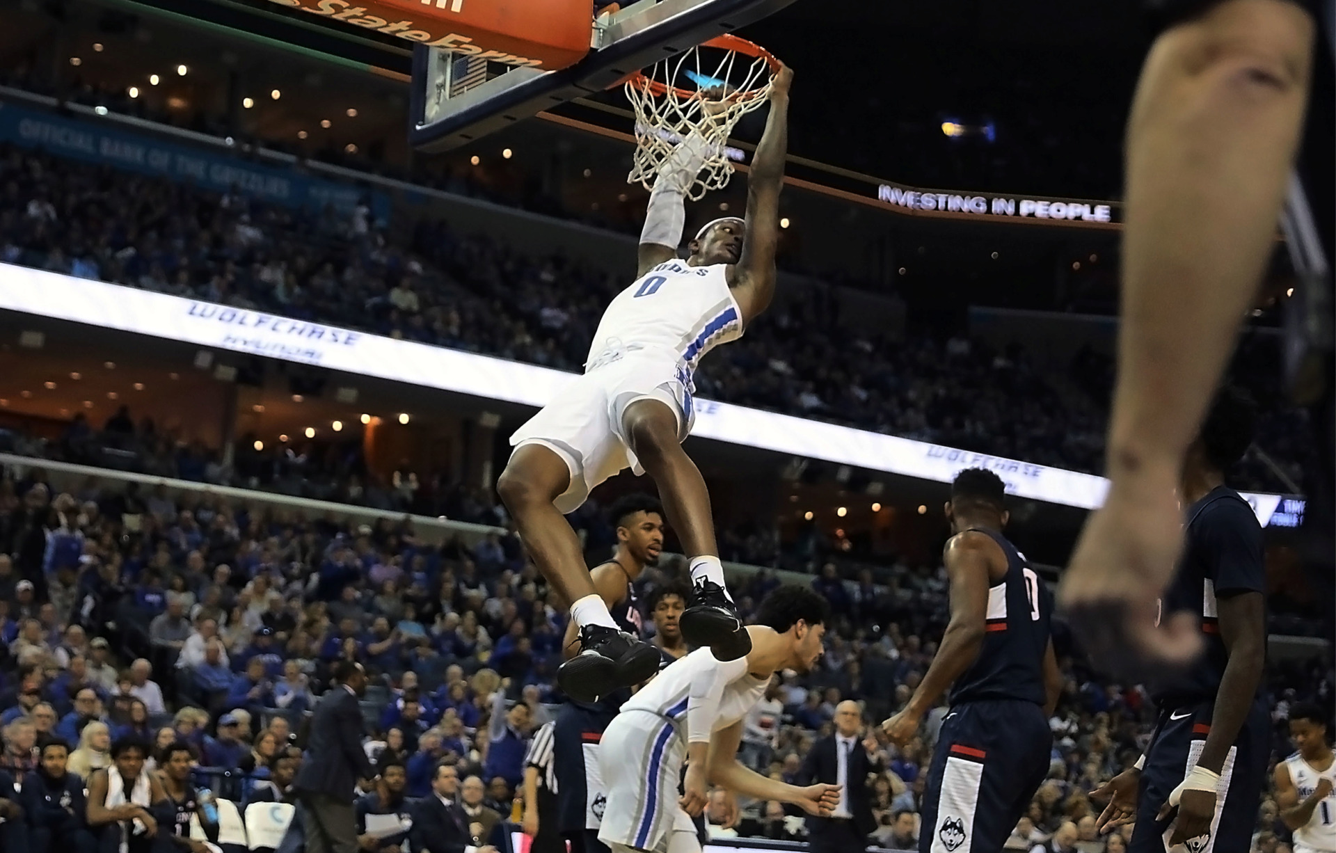 <strong>Kyvon Davenport brings the fans at FedExForum to their feet with a dunk in the first half against the University of Connecticut Huskies on Sunday, Feb. 10.</strong> (Patrick Lantrip/Daily Memphian)