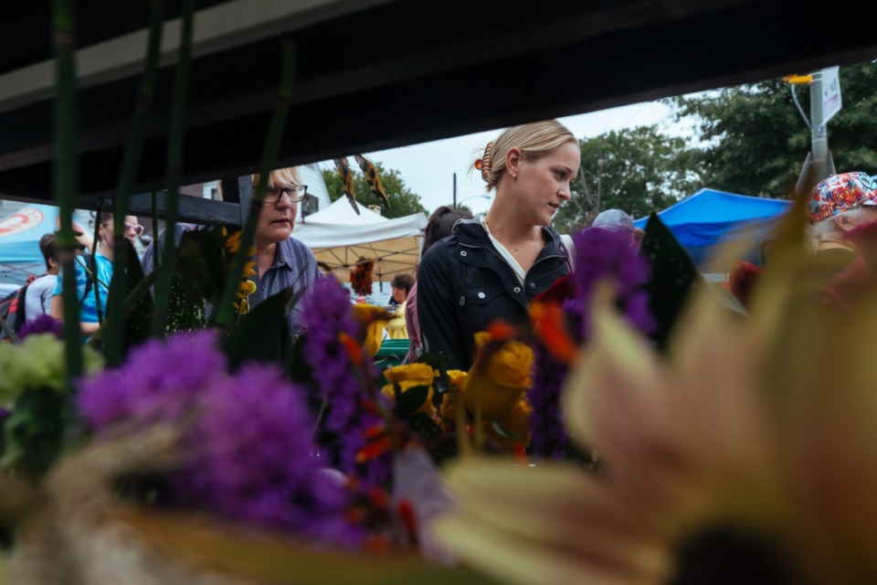 <strong>Callie (left) and Darrylee Arms check out blooms at Enchante Flower Shop.</strong> (Ziggy Mack/Special to The Daily Memphian)