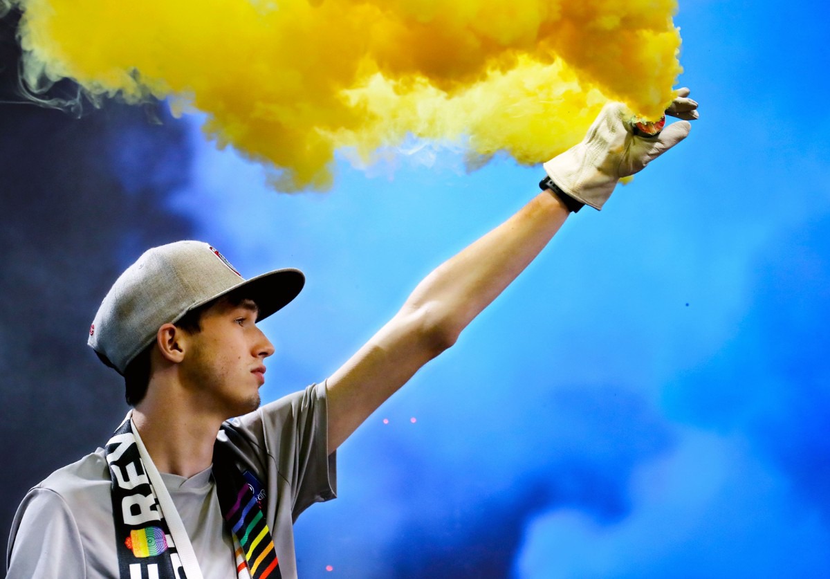 <strong>A member of the Bluff City Mafia lights up a smoke grenade on Sept. 22 before&nbsp; the home match against Indy Eleven.</strong> (Patrick Lantrip/Daily Memphian)