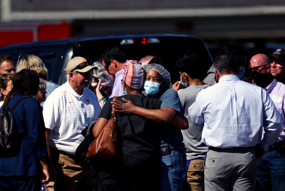 <strong>Survivors of the shooting at a Kroger in Collierville console each other Thursday afternoon.</strong> (Patrick Lantrip/Daily Memphian)