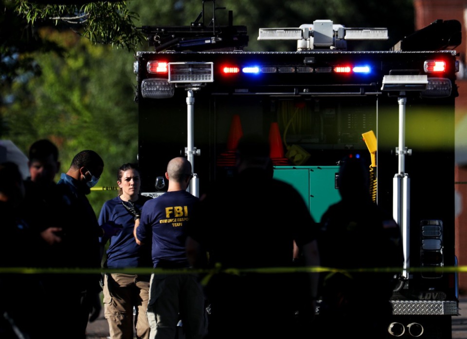 <strong>The FBI gathers at the scene of the mass shooting at a Kroger in Collierville on Sept. 23, 2021.</strong> (Patrick Lantrip/Daily Memphian)