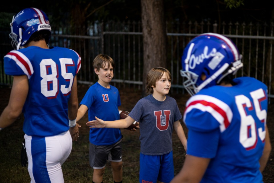 <strong>Young fans slap hands with MUS players before the start of Friday night&rsquo;s game against Ridgeway.</strong> (Brad Vest/Daily Memphian)