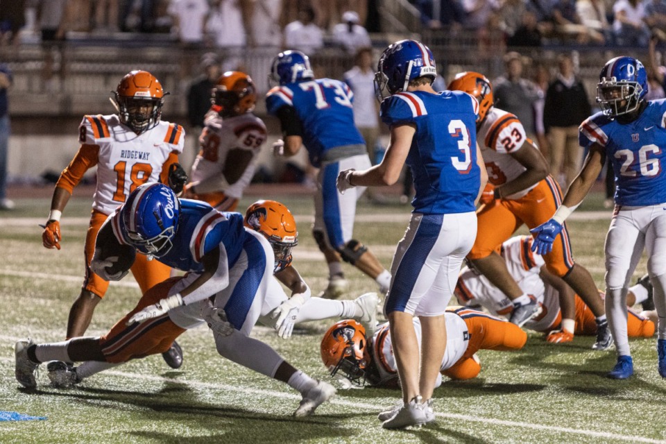 <strong>MUS&rsquo; Tee Perry scores a touchdown against Ridgeway during Friday night&rsquo;s game at Memphis University School.</strong> (Brad Vest/Daily Memphian)