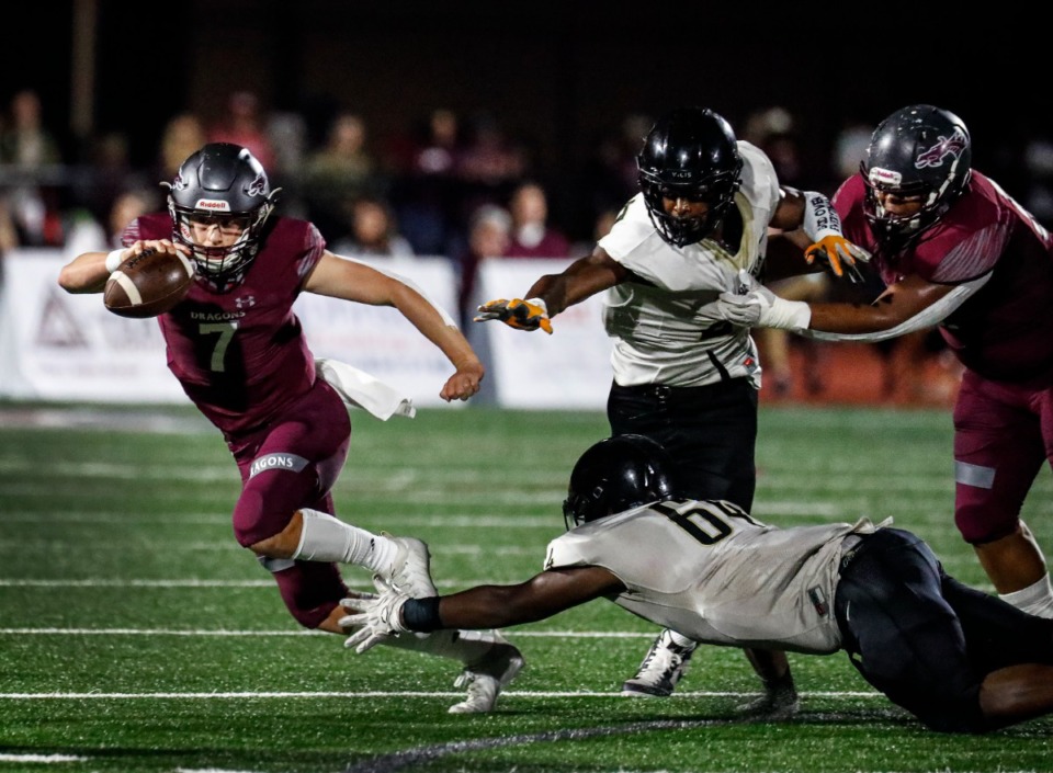 <strong>Collierville quarterback Houston Wilhelm (left) is taken down by the Whitehaven defense on Friday, Sept. 24, 2021.</strong> (Mark Weber/The Daily Memphian)
