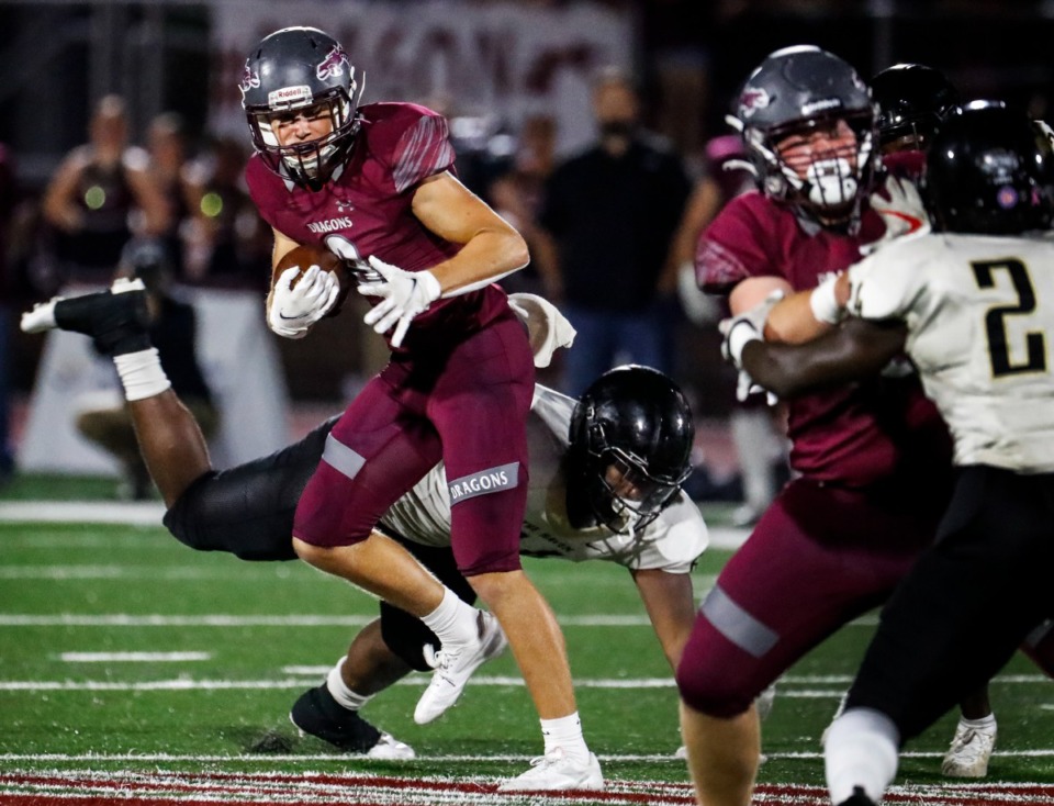 <strong>Collierville receiver Noah Flaskamp (left) scrambles for a first down against Whitehaven on Friday, Sept. 24, 2021.</strong> (Mark Weber/The Daily Memphian)