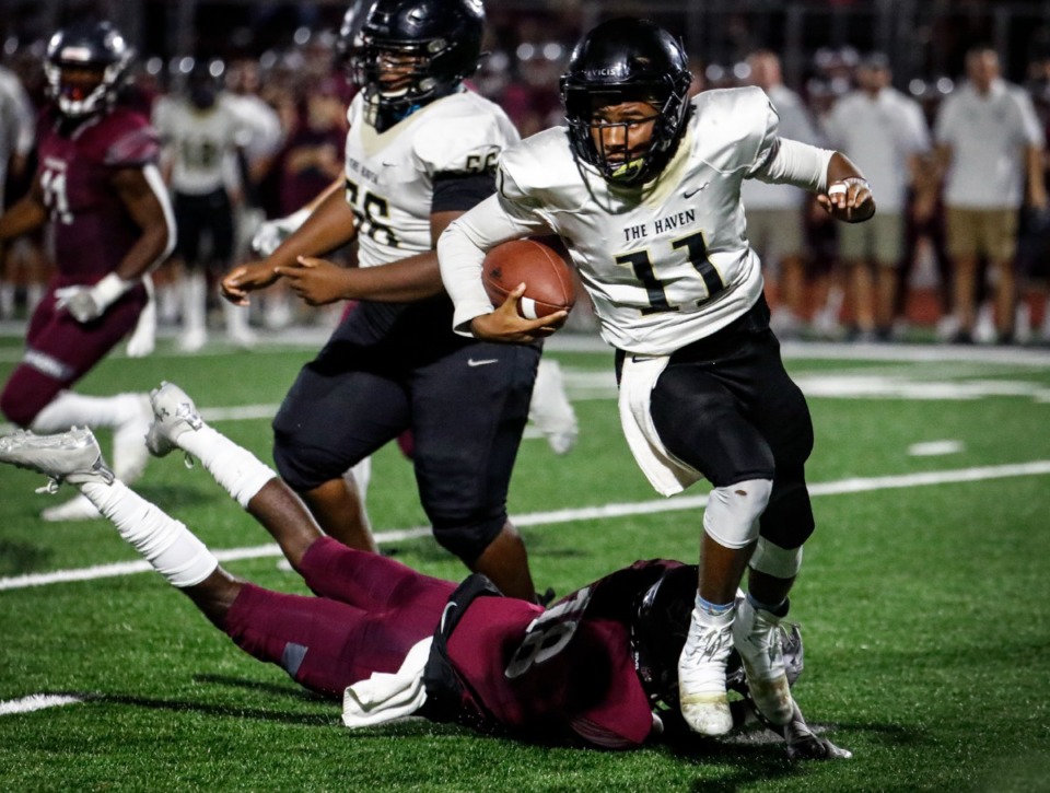 <strong>Whitehaven quarterback William Carver (top) dodges Collierville defenders on Friday, Sept. 24, 2021.</strong> (Mark Weber/The Daily Memphian)