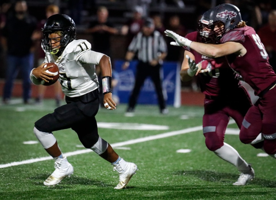 <strong>Whitehaven quarterback William Carver (left) runs for yardage in the game against Collierville on Sept. 24, 2021.</strong> (Mark Weber/The Daily Memphian)