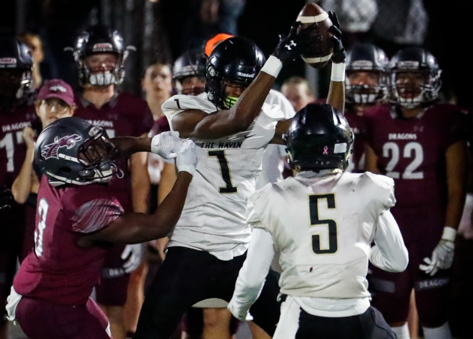 <strong>Whitehaven&rsquo;s JaQuez Bradley (middle) intercepts a pass in front of Collierville&rsquo;s John Hampton (left) on Friday, Sept. 24, 2021.</strong> (Mark Weber/The Daily Memphian)