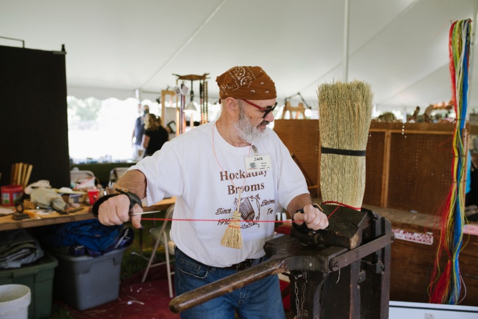 <strong>Jack Martin of Hockaday Brooms&nbsp; demonstrates his broom-making skill at the Pink Palace Crafts Fair.</strong> (Lucy Garrett/Special to the Daily Memphian)