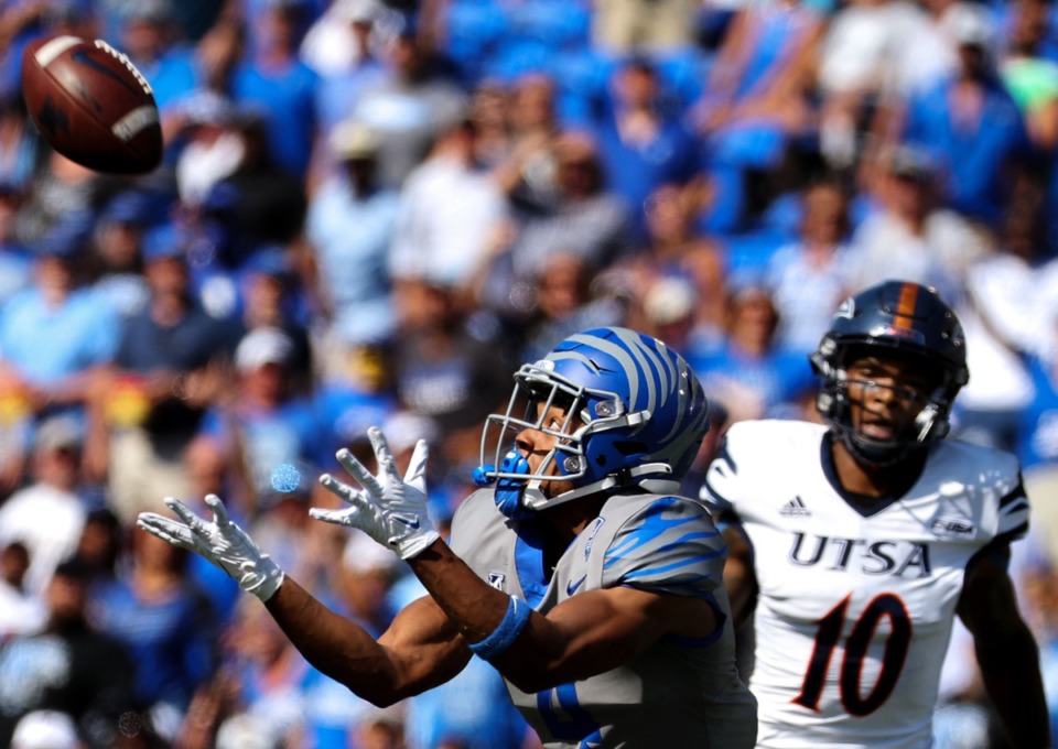 <strong>University of Memphis receiver Calvin Austin III (4) makes a catch while being tailed by University of Texas San Antonio safety Clifford Chattman (10) Saturday at Liberty Bowl Memorial Stadium.</strong> (Patrick Lantrip/Daily Memphian)