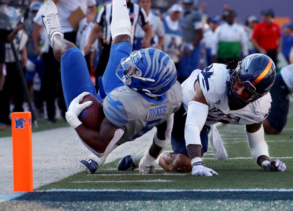 <strong>University of Memphis tight end Sean Dykes (5) dives for the pylon in front of a University of Texas San Antonio defender during a Sept. 25, 2021 game at the Liberty Bowl Memorial Stadium in Memphis.</strong> (Patrick Lantrip/Daily Memphian)