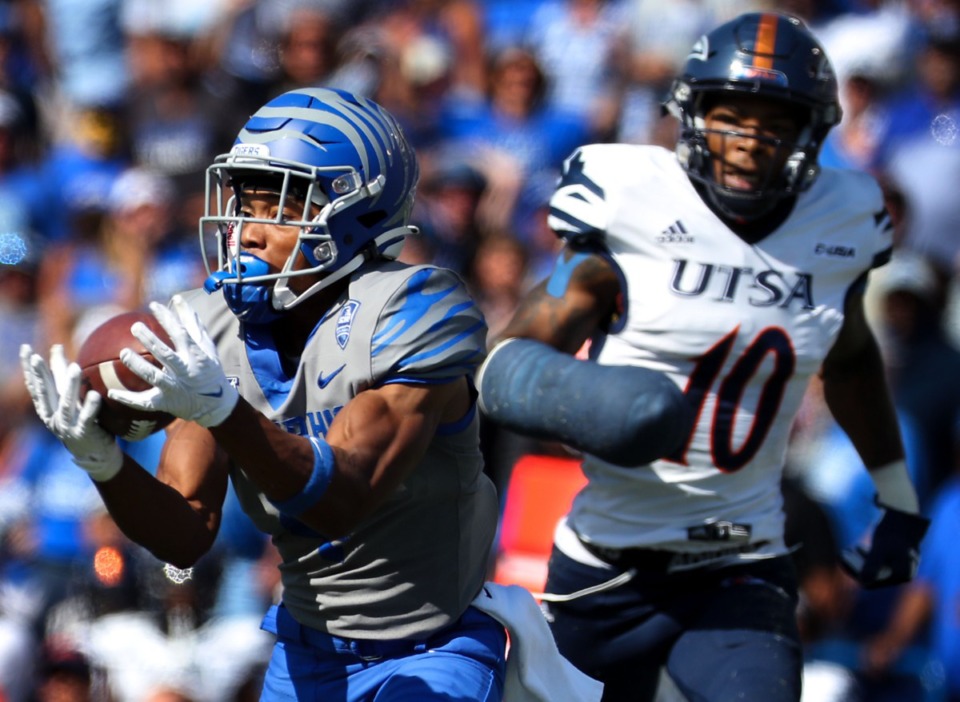 <strong>University of Memphis receiver Calvin Austin III (4) hauls in the ball while being tailed by University of Texas San Antonio safety Clifford Chattman (10).</strong> (Patrick Lantrip/Daily Memphian)