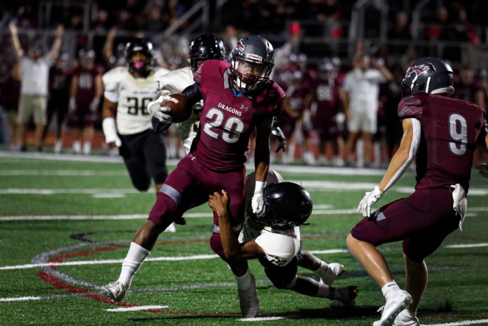 <strong>Collierville running back Troy Martin (middle) scrambles past the Whitehaven defense for a touchdown during action on Friday, Sept. 24, 2021.</strong> (Mark Weber/The Daily Memphian)