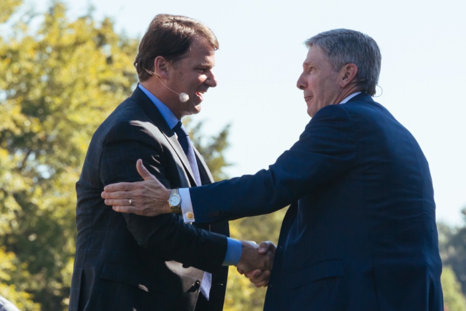 <strong>Ford CEO Jim Farley (left) and state Economic and Community Development Commissioner Bob Rolfe greet each other at the formal announcement Tuesday, Sept. 28, of Ford&rsquo;s decision to make batteries at the megasite for its all-electric F150 pickup trucks.</strong> (Ziggy Mack/Special to the Daily Memphian)