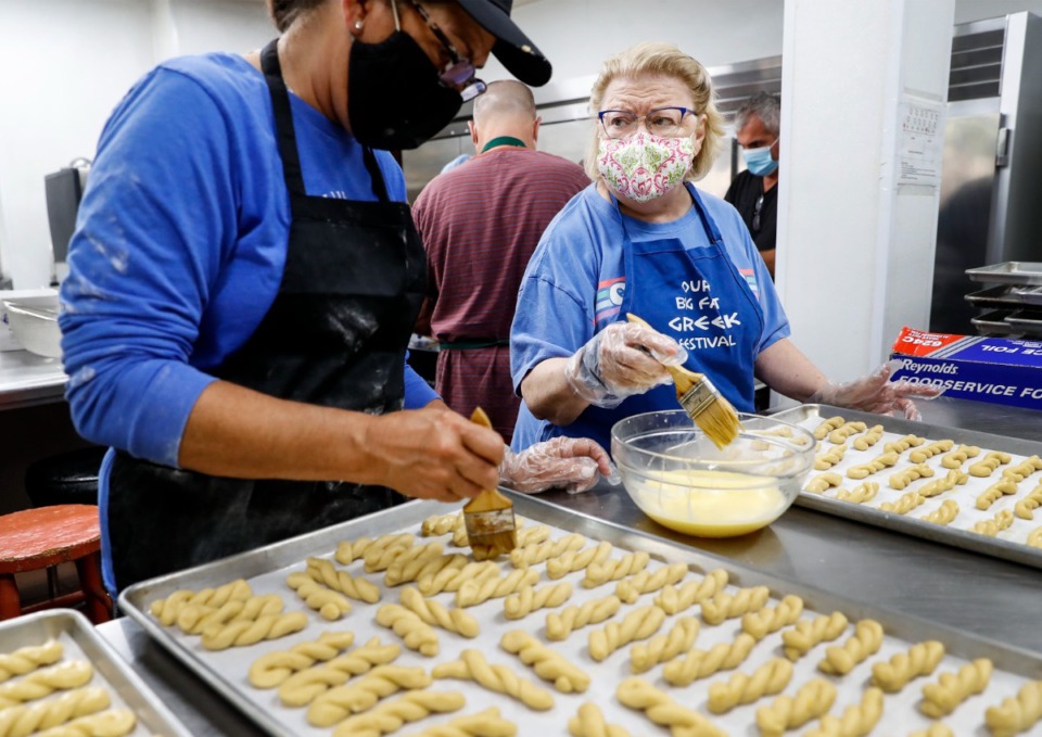 <strong>Elaine Otto (left) and Linda Nichols (right) make koulouria butter cookies at Annunciation Greek Orthodox Church while preparing for the church&rsquo;s upcoming&nbsp;</strong><strong>Greek Festival.</strong> (Mark Weber/The Daily Memphian)