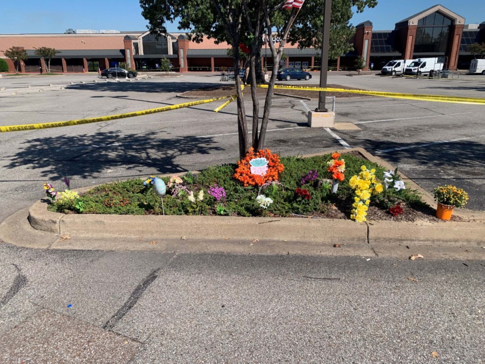 <strong>Flower arrangements have been left outside the Collierville Kroger where Olivia King was killed.</strong> (Abigail Warren/Daily Memphian)