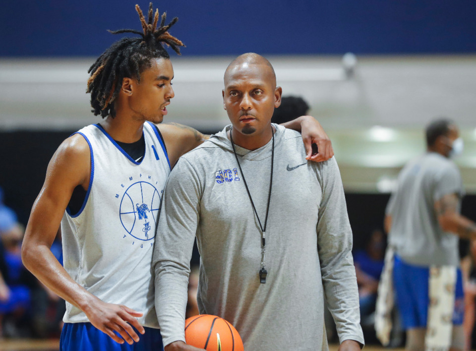 <strong>Tigers forward Emoni Bates (left) chats with head coach Penny Hardaway (right) during the first day of practice on Tuesday, Sept. 28, 2021.</strong> (Mark Weber/The Daily Memphian)