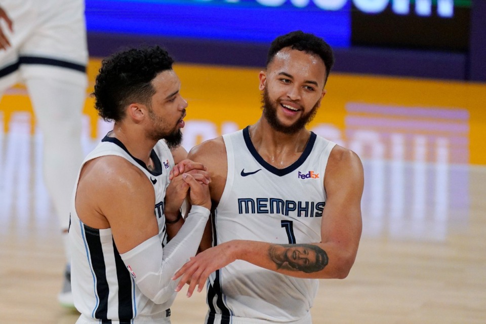 <strong>Memphis Grizzlies guard Dillon Brooks, left, and forward Kyle Anderson congratulate each other during a timeout in the first half of the team's NBA basketball game against the Los Angeles Lakers on Friday, Feb. 12, 2021, in Los Angeles.</strong> (AP Photo/Mark J. Terrill)