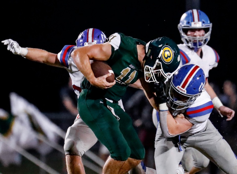<strong>MUS&rsquo; Jack Ryan (right) is called for a personal foul after grabbing the facemask of Briarcrest quarterback JD Sherrod (left) on Friday, Oct. 1, 2021.</strong> (Mark Weber/The Daily Memphian)