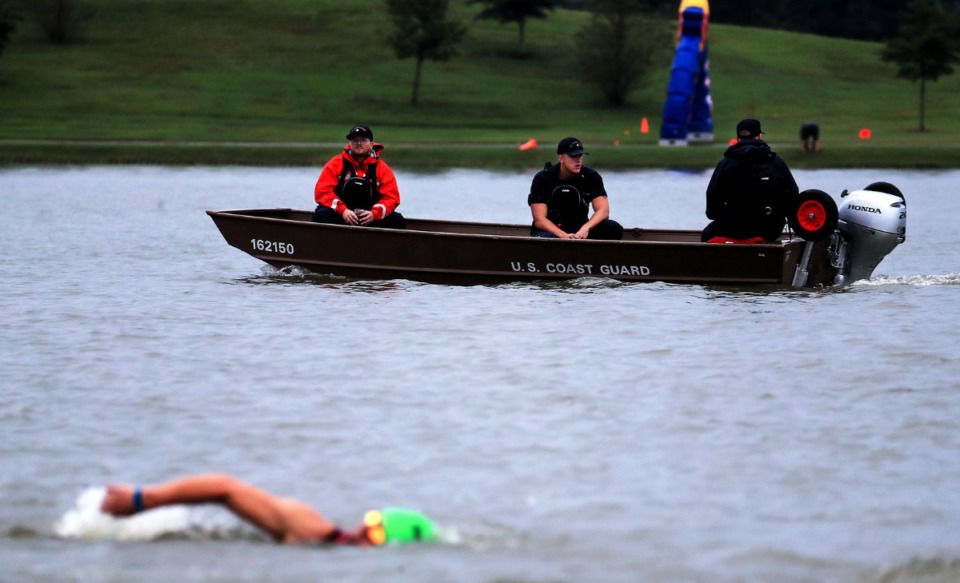 <strong>Members of the U.S. Coast Guard keep a watchful eye on the swimmers during the first leg of the St.Jude IRONMAN 70.3 Memphis race at Shelby Farms Oct. 2, 2021.</strong> (Patrick Lantrip/Daily Memphian)