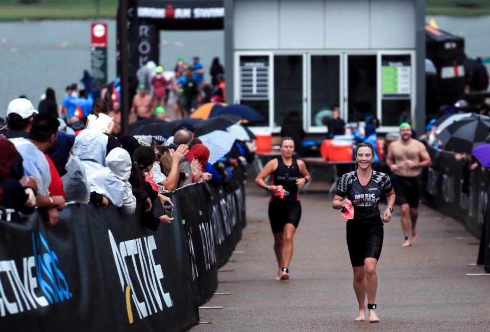 <strong>Contestants run to their bikes after the first leg of the St.Jude IRONMAN 70.3 Memphis race at Shelby Farms Oct. 2, 2021.</strong> (Patrick Lantrip/Daily Memphian)
