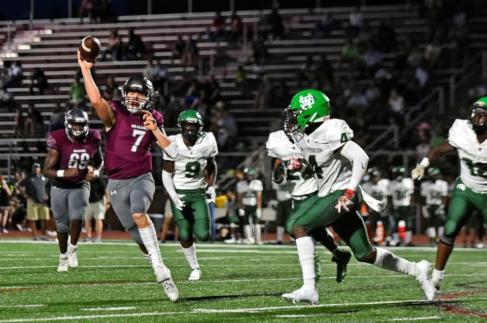 <strong>Collierville quarterback Houston Wilhelm (7) throws a pass under pressure from White Station on Friday, Sept. 3, 2021.</strong> (Justin Ford/Special to The Daily Memphian)