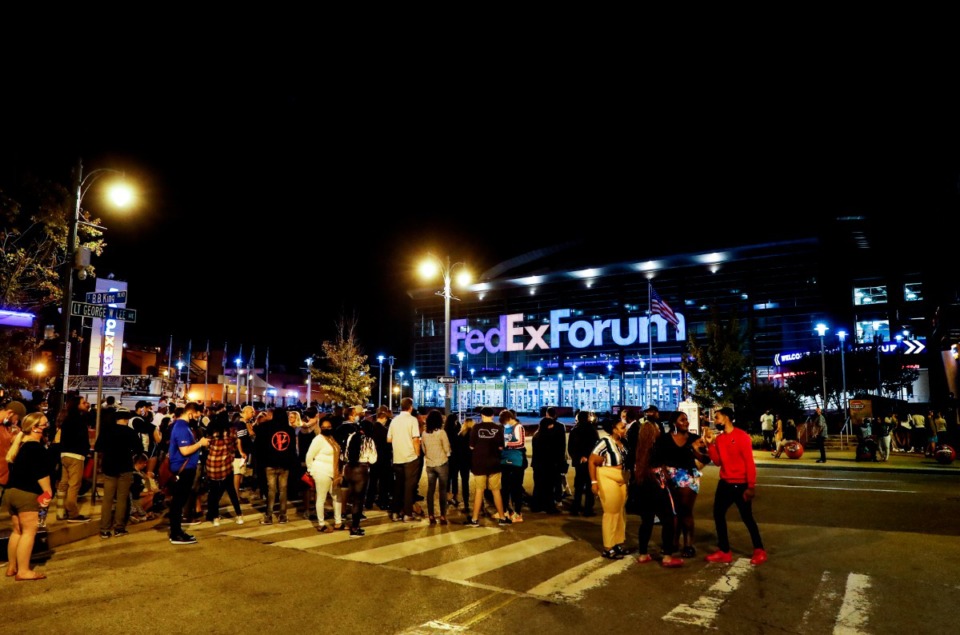 <strong>Memphis Grizzlies fans stand outside the FedExForum after a fire alarm stopped their preseason game against the Milwaukee Bucks at the end of the third quarter on Tuesday, Oct. 5, 2021.</strong> (Mark Weber/The Daily Memphian)