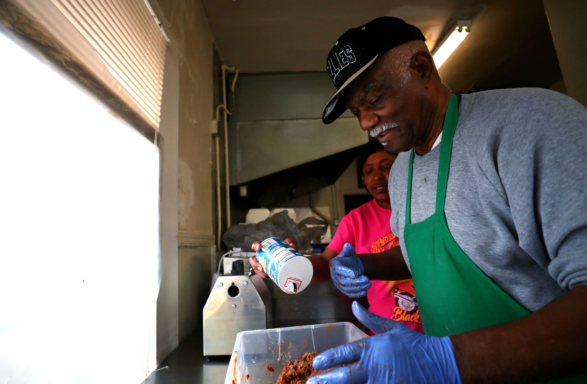 <strong>Pop's Hot Tamales owner Lee &ldquo;Pops&rdquo; Crumb (right) and cook Joyce Shannon season ground beef before cooking it Thursday, Feb. 14, 2019. The restaurant at 2467 Park Ave., which is taking part in Orange Mound Black Restaurant Week, serves tamales two ways &ndash; mild and hot &ndash; and accepts cash only.</strong> (Houston Cofield/Daily Memphian)