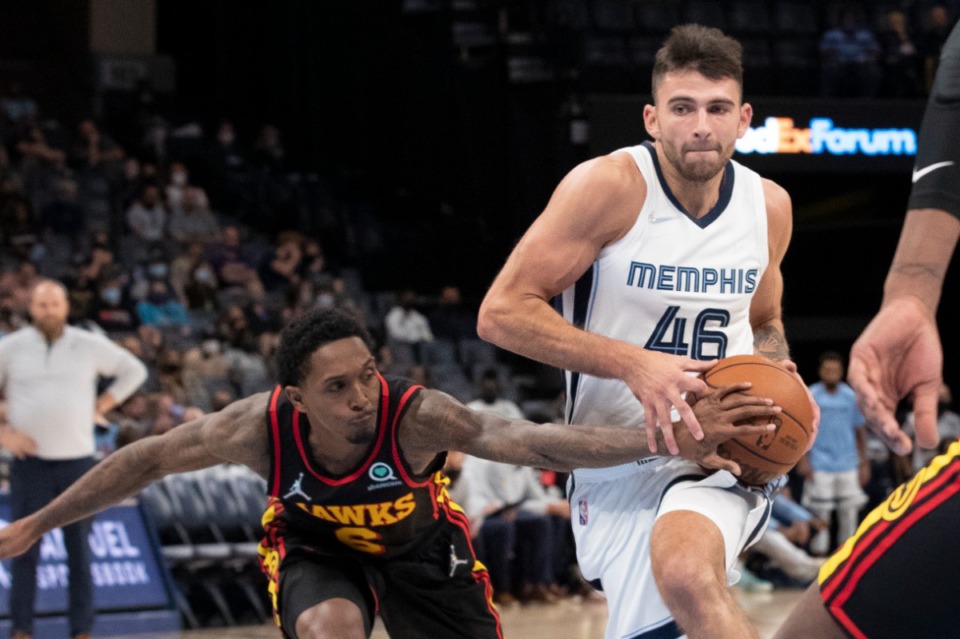 <strong>Atlanta Hawks guard Lou Williams (6) reaches in as he defends Memphis Grizzlies guard John Konchar (46) in the second half at FedExForum on Saturday, Oct. 9.</strong> (Nikki Boertman/Associated Press)