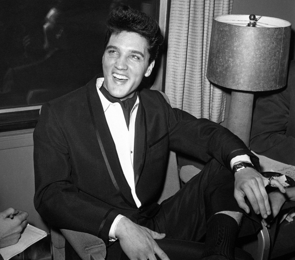 <strong>Elvis Presley smiled during a press conference inside his private railroad car at Los Angeles Union Station, as he arrived on April 20, 1960, to make a movie.</strong> (AP file Photo/HPM)