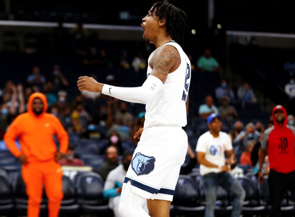 <strong>Grizzlies guard Ja Morant (12) celebrates after a dunk during the Oct. 11 preseason game against the Detroit Pistons.</strong> (Patrick Lantrip/Daily Memphian)