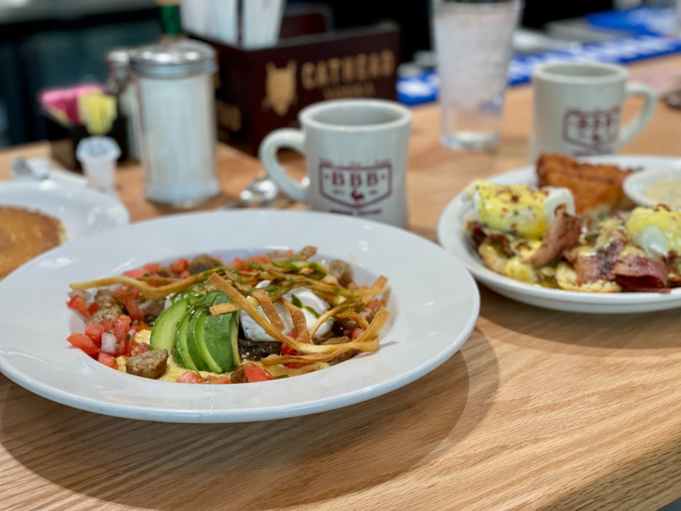 <strong>Huevos rancheros (left) and redneck benny are two of the numerous breakfast dishes at Big Bad Breakfast, which also has a smaller lunch menu.</strong> (Jennifer Biggs/Daily Memphian)
