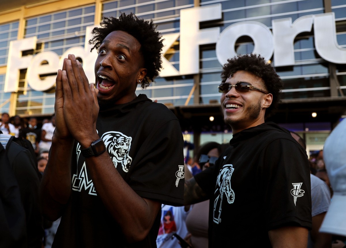 <strong>University of Memphis players DeAndre Williams and Lester Quinones laugh with fans outside of FedExForum before Memphis Madness Oct. 13, 2021.</strong> (Patrick Lantrip/Daily Memphian)