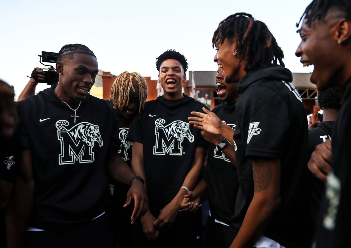 <strong>University of Memphis players dance on the blue carpet outside of FedExForum before Memphis Madness Oct. 13, 2021.</strong> (Patrick Lantrip/Daily Memphian)