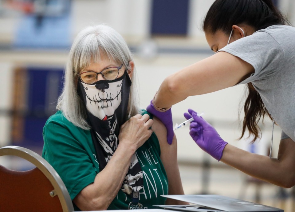 <strong>Art teacher Leanne Wilson receivers a vaccine shot during Arlington High School&rsquo;s vaccination event on Friday, March 26, 2021. </strong>&nbsp;(Mark Weber/The Daily Memphian file)