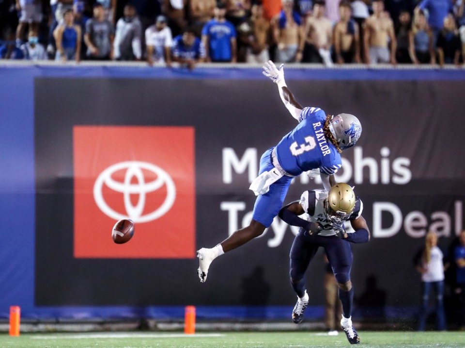 <strong>University of Memphis receiver Roc Taylor (3) gets upended by a Navy defender on Oct. 14at the Liberty Bowl.</strong> (Patrick Lantrip/Daily Memphian)