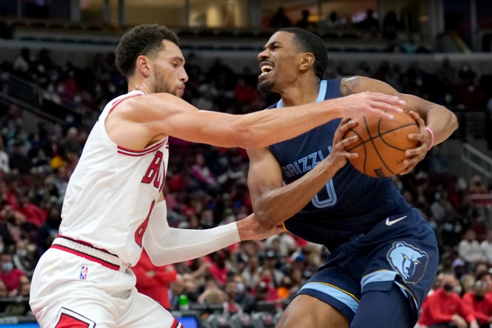 <strong>Chicago&rsquo;s Zach LaVine, left, pressures Memphis Grizzlies' De'Anthony Melton on Oct. 15 in Chicago.</strong> (Charles Rex Arbogast/AP)