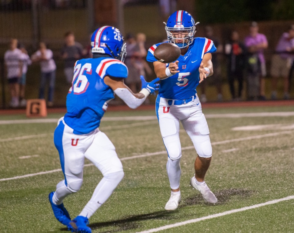 <strong>MUS quarterback George Hamsley (5) pitches out to running back Hunter Barnes (26) on Friday, Oct. 15, 2021.</strong> (Greg Campbell/Special to The Daily Memphian)