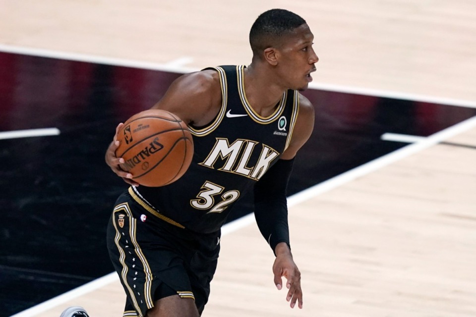 <strong>The Memphis Grizzlies have waived guard Kris Dunn (32) (playing for the Atlanta Hawks in a file photo).</strong> (AP Photo/Brynn Anderson)