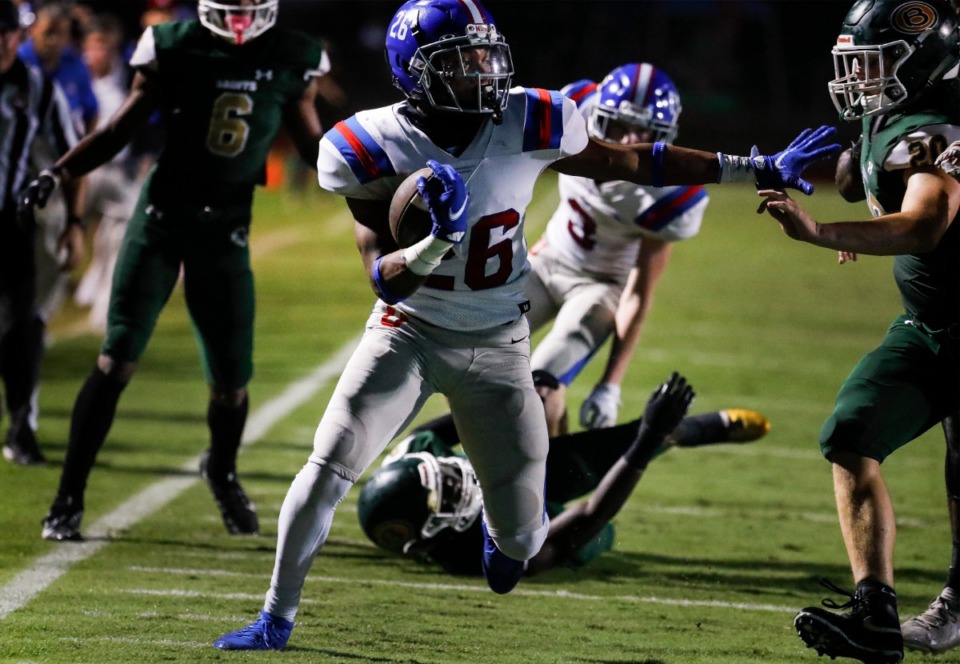 <strong>MUS running back Hunter Barnes (middle) scrambles for a first down against the Briarcrest defense during action on Friday, Oct. 1, 2021.</strong> (Mark Weber/The Daily Memphian)