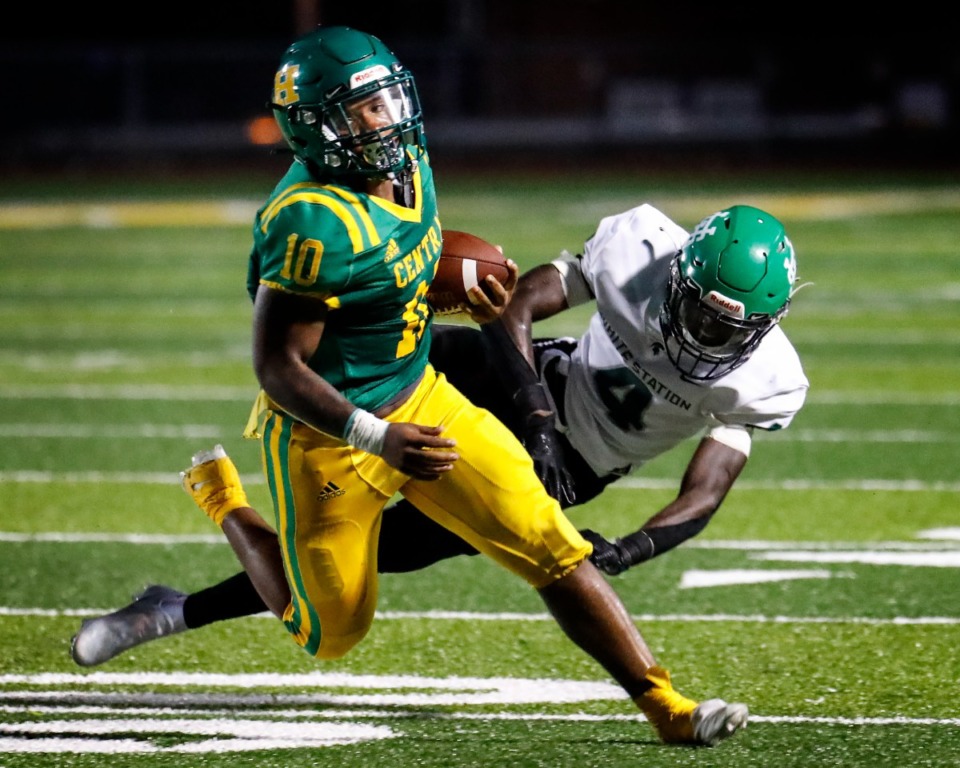 <strong>Central running back Jamarious Brooks (front) runs by White Station defender Shamari Covington (back) during action on Friday, Aug. 27, 2021.</strong> (Mark Weber/The Daily Memphian file)