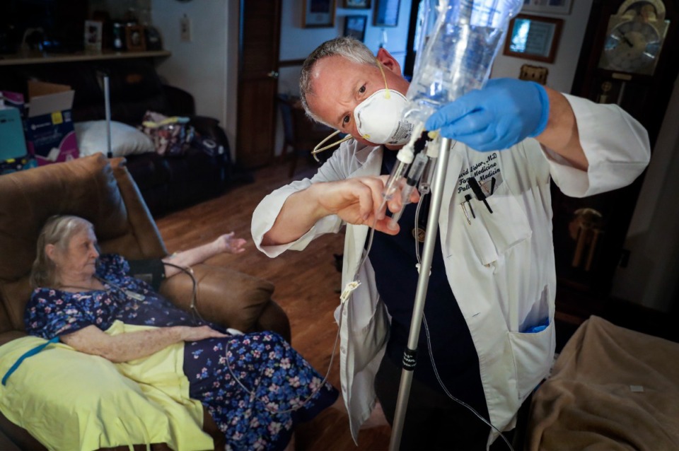 <strong>Dr. David Weber, founder and CEO of&nbsp; Housecall Family Medicine, administers monoclonal antibodies to COVID patient Rachell Meridieth on Monday, Oct. 18, at her Lakeland home. Weber also is Meritan&rsquo;s medical director.</strong> (Mark Weber/Daily Memphian)