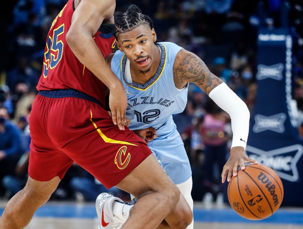 <strong>Grizzlies guard Ja Morant (right) drives by Cleveland Cavaliers defender Isaac Okoro (left) on Wednesday, Oct. 20, 2021.</strong> (Mark Weber/The Daily Memphian)