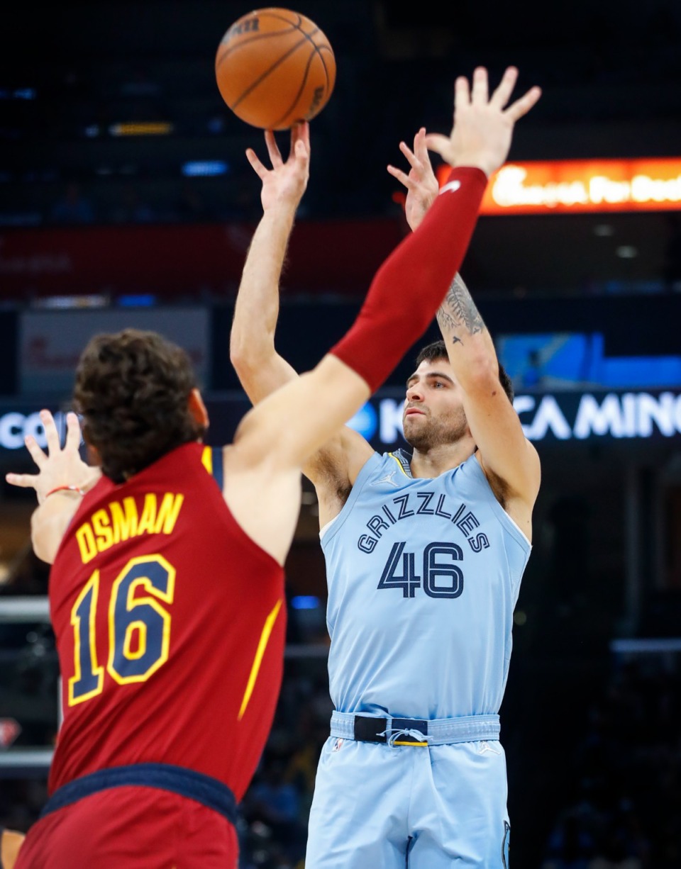 <strong>Grizzlies guard John Konchar (right) shoots over Cleveland&rsquo;s Cedi Osman (left) on Wednesday, Oct. 20, 2021.</strong> (Mark Weber/The Daily Memphian)