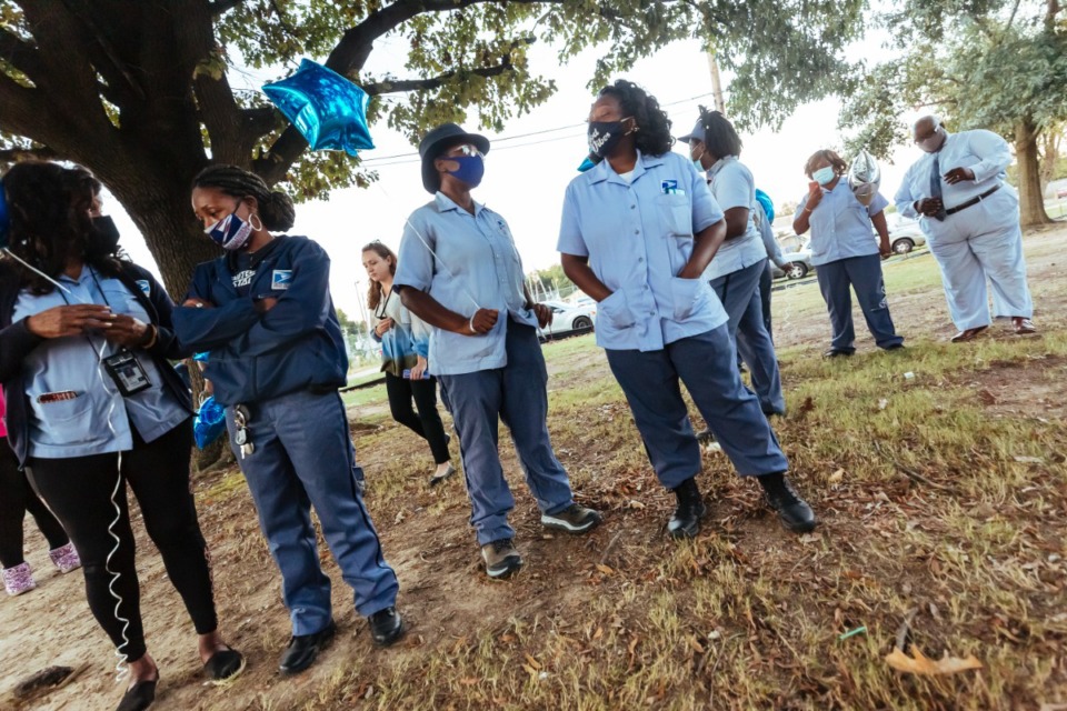 <strong>Co-workers of slain post office employee Demetria Dortch attend the vigil at Lewis-Davis Park in Orange Mound on Oct. 20, 2021.</strong> (Ziggy Mack/Special to The Daily Memphian)