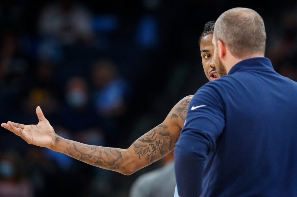 <strong>Grizzlies guard Ja Morant (back) talks to head coach Tyler Jenkins (front) during the game against the Cleveland Cavaliers on Wednesday, Oct. 20, 2021.</strong> (Mark Weber/The Daily Memphian)
