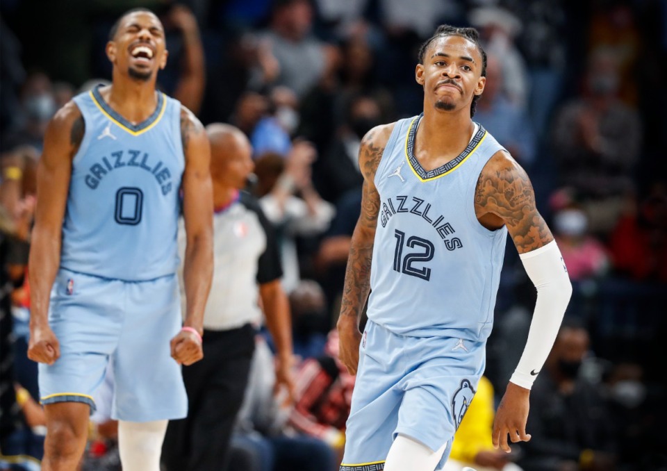 <strong>Grizzlies De'Anthony Melton (left) and Ja Morant (right) celebrate during the final minutes of a victory over the Cleveland Cavaliers on Wednesday, Oct. 20, 2021.</strong> (Mark Weber/The Daily Memphian)