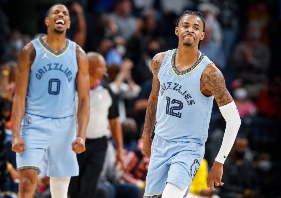 <strong>Memphis Grizzlies teammates De'Anthony Melton (left) and Ja Morant celebrate during the final minutes of a victory over the Cleveland Cavaliers on Wednesday, Oct. 20, 2021 at FedExForum.</strong> (Mark Weber/The Daily Memphian)