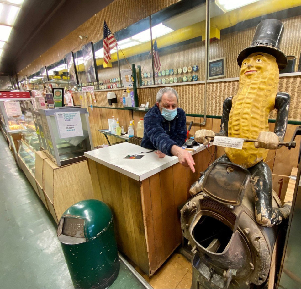 <strong>Shop owner Rida AbuZaineh shows his 74-year-old Mr. Peanut and 92-year-old roaster at the Peanut Shoppe on Main Street in Downtown Memphis.</strong> (Tom Bailey/Daily Memphian file)