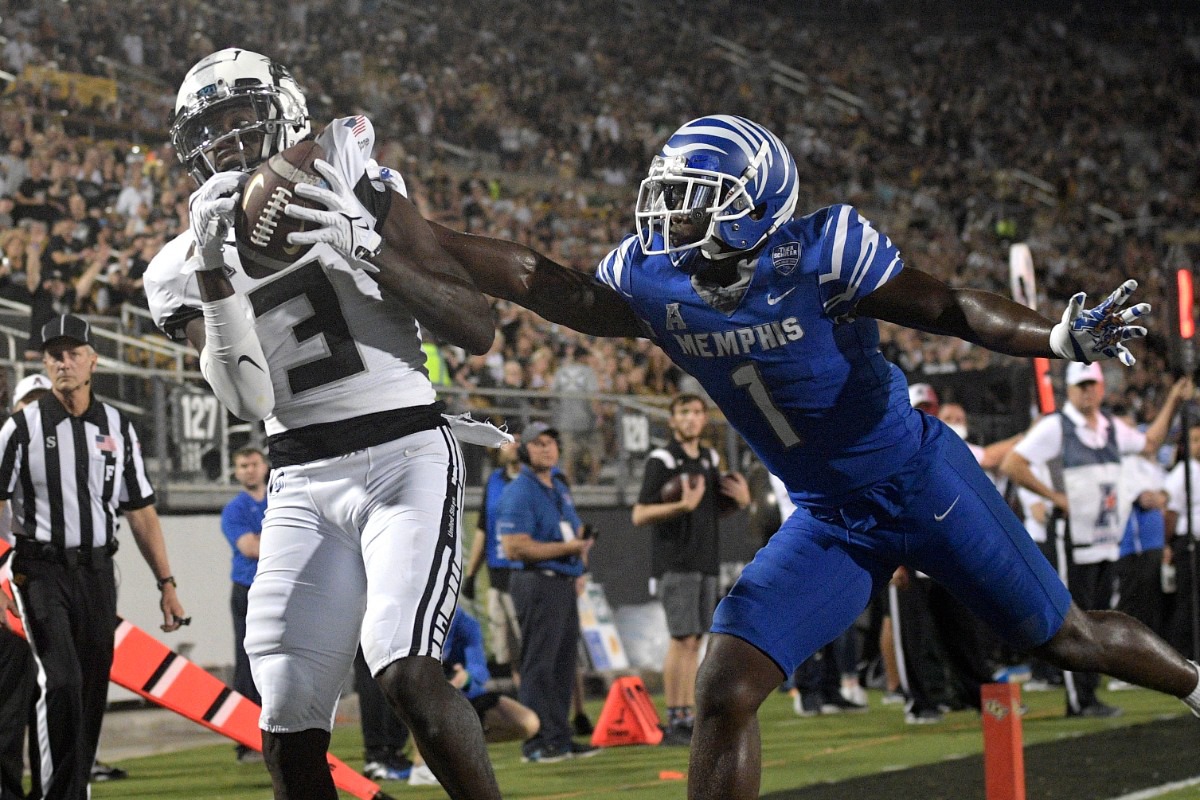 <strong>Central Florida wide receiver Brandon Johnson (3) makes a reception in the end zone in front of Memphis defensive back Jacobi Francis (1) for an 11-yard touchdown on Oct. 22, 2021, in Orlando, Florida.</strong> (Phelan M. Ebenhack/Orlando Sentinel via AP)